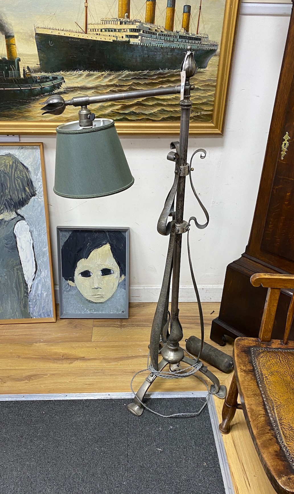 An Art Nouveau style wrought iron telescopic lamp standard